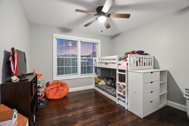 bedroom featuring ceiling fan and dark hardwood / wood-style flooring