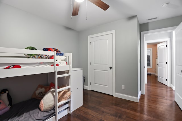 bedroom featuring dark wood-type flooring and ceiling fan