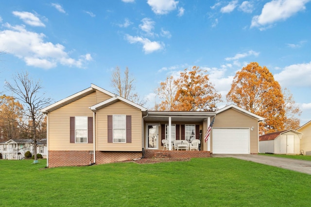 ranch-style home with a front lawn, a shed, a garage, and covered porch