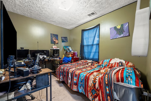 carpeted bedroom with a textured ceiling