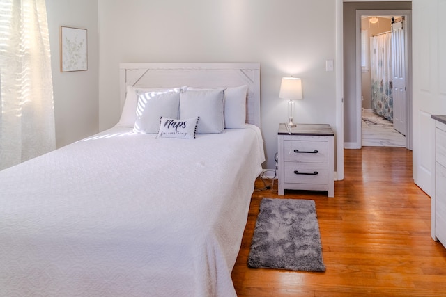 bedroom featuring hardwood / wood-style flooring