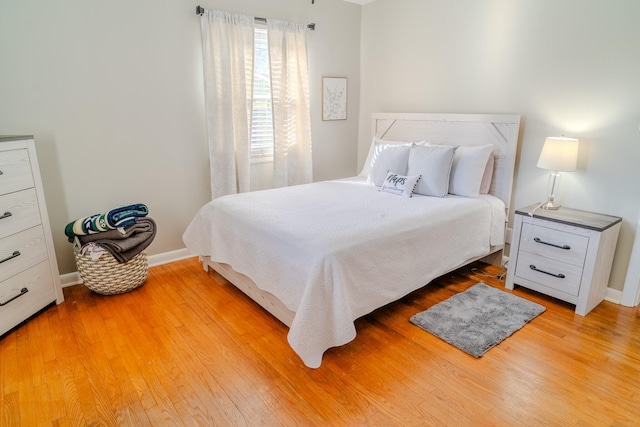 bedroom with light hardwood / wood-style flooring