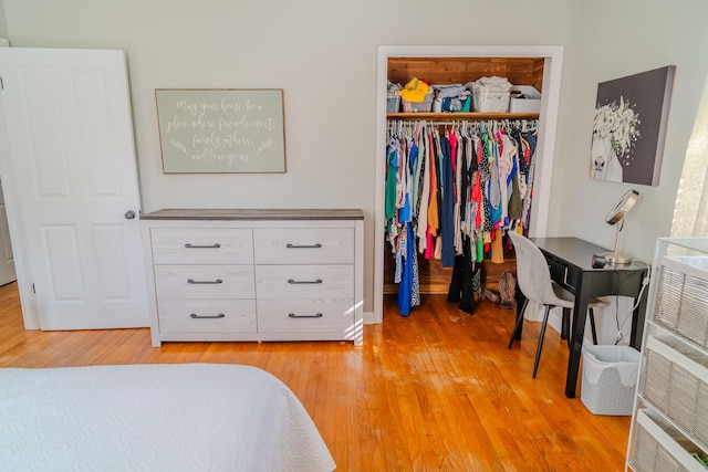 bedroom with a closet and light wood-type flooring