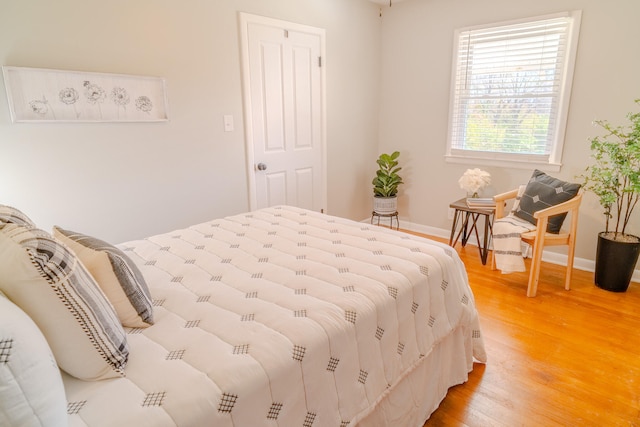 bedroom with wood-type flooring