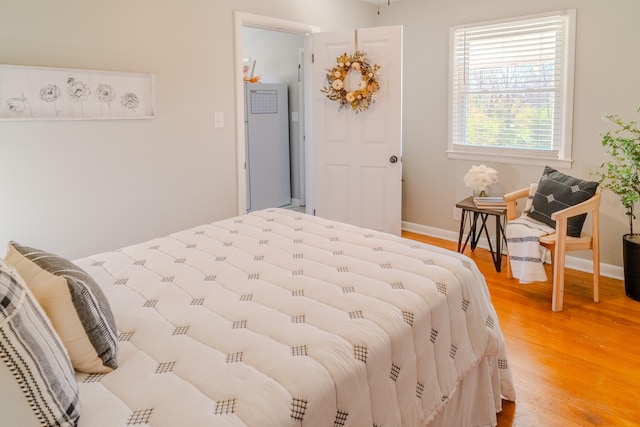 bedroom with hardwood / wood-style floors