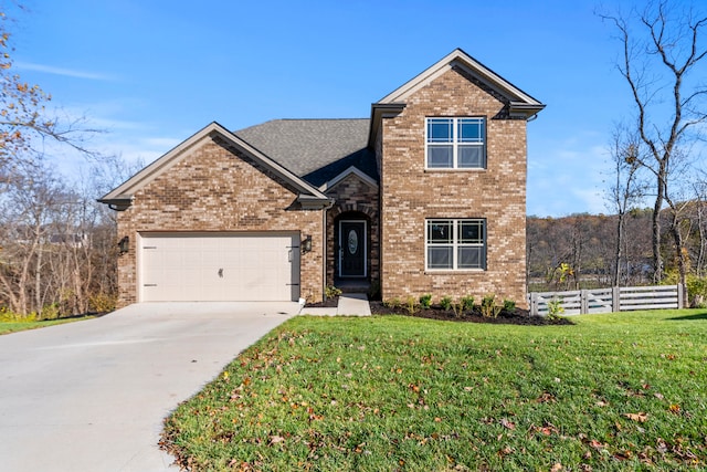 view of front property with a front yard and a garage