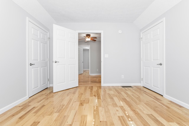 unfurnished bedroom with light wood-type flooring