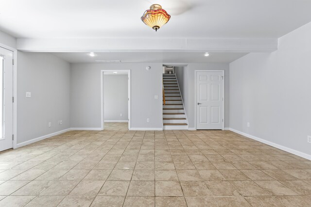 spare room featuring light tile patterned flooring