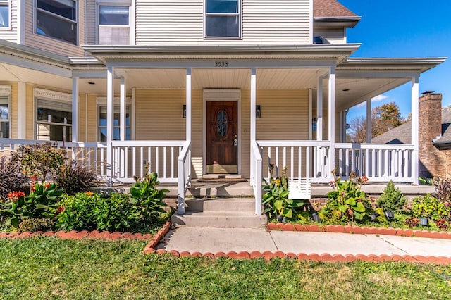 property entrance with covered porch