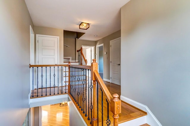 staircase featuring hardwood / wood-style flooring