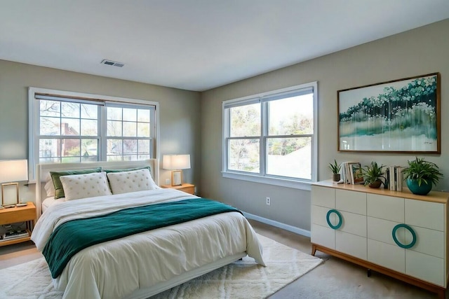 bedroom with light carpet