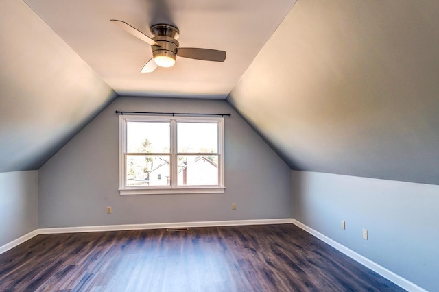 bonus room with ceiling fan, dark wood-type flooring, and lofted ceiling