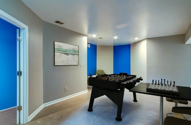 game room with concrete flooring