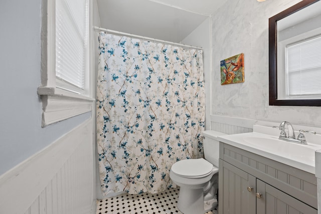 bathroom with vanity, tile patterned floors, toilet, and a shower with shower curtain