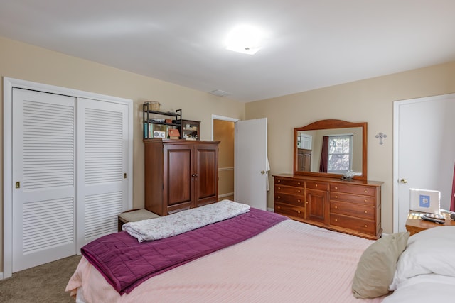 bedroom with a closet and light colored carpet