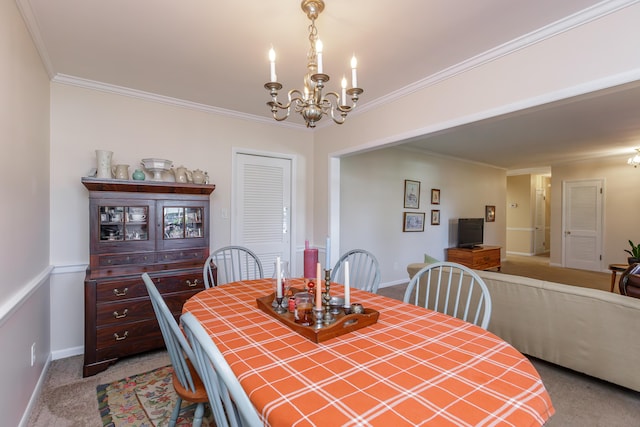 dining room with light colored carpet, a notable chandelier, and ornamental molding