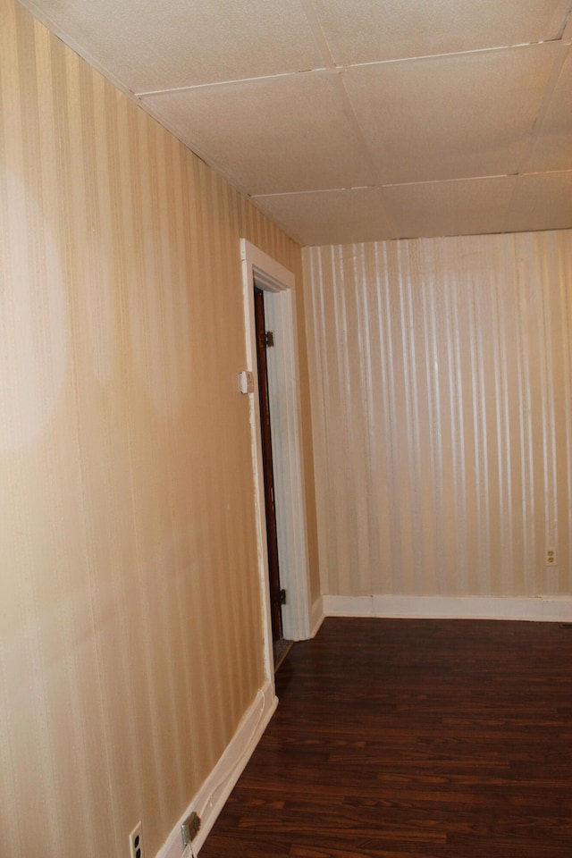 hallway featuring dark hardwood / wood-style flooring