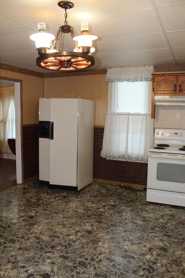 kitchen featuring white appliances, a chandelier, a paneled ceiling, and pendant lighting