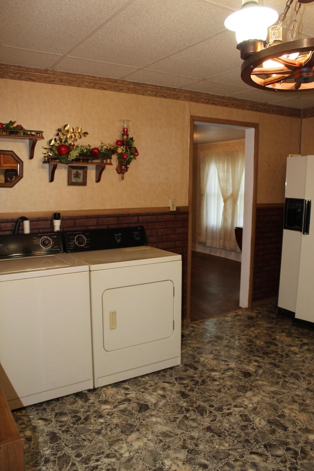 laundry room with separate washer and dryer