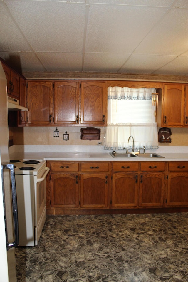 kitchen featuring white electric range, a paneled ceiling, and sink