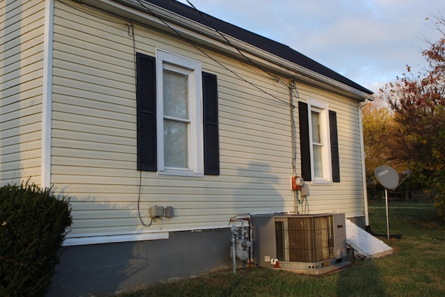 view of home's exterior with central AC