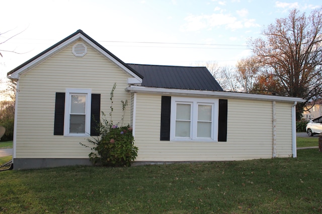 view of home's exterior featuring a yard