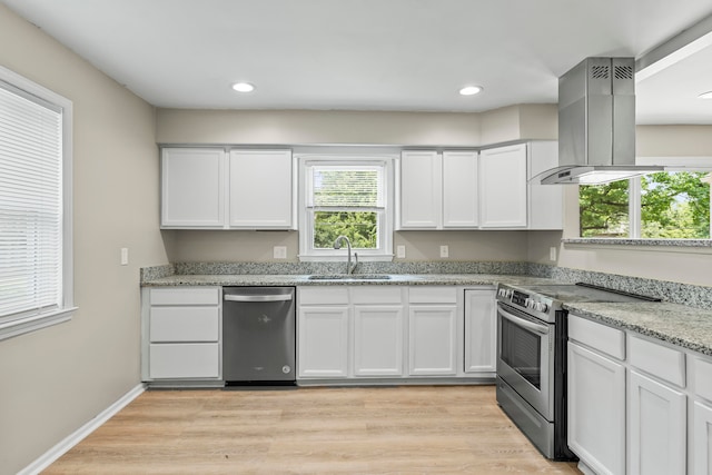 kitchen featuring white cabinetry, sink, stainless steel appliances, light hardwood / wood-style floors, and island range hood