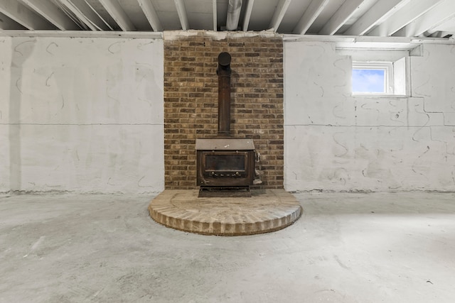 basement featuring a wood stove