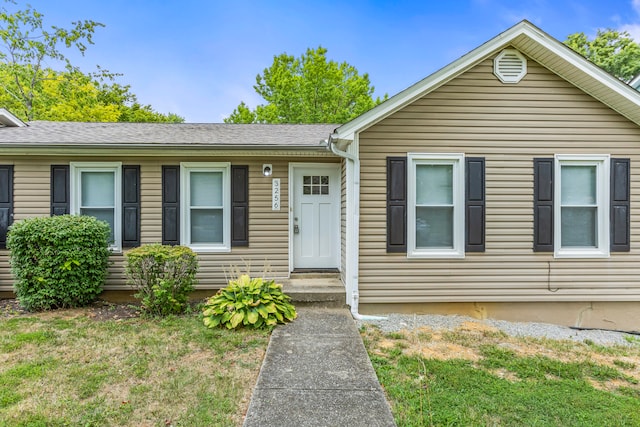 view of front of home with a front yard