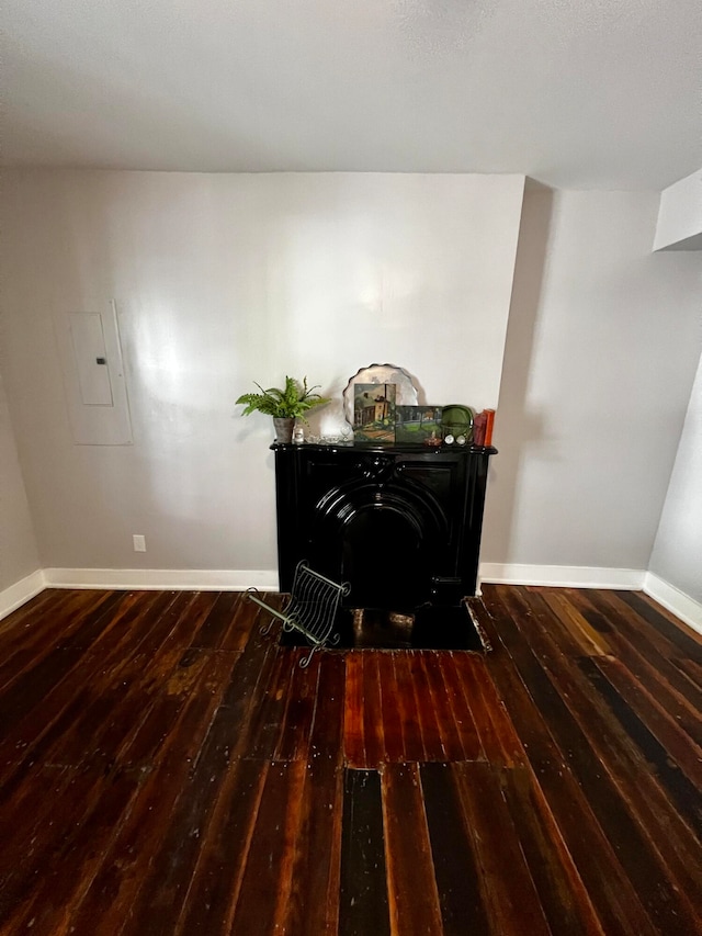 interior space with electric panel and hardwood / wood-style floors