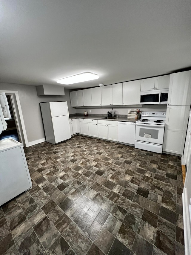 kitchen with white cabinetry, white appliances, and sink