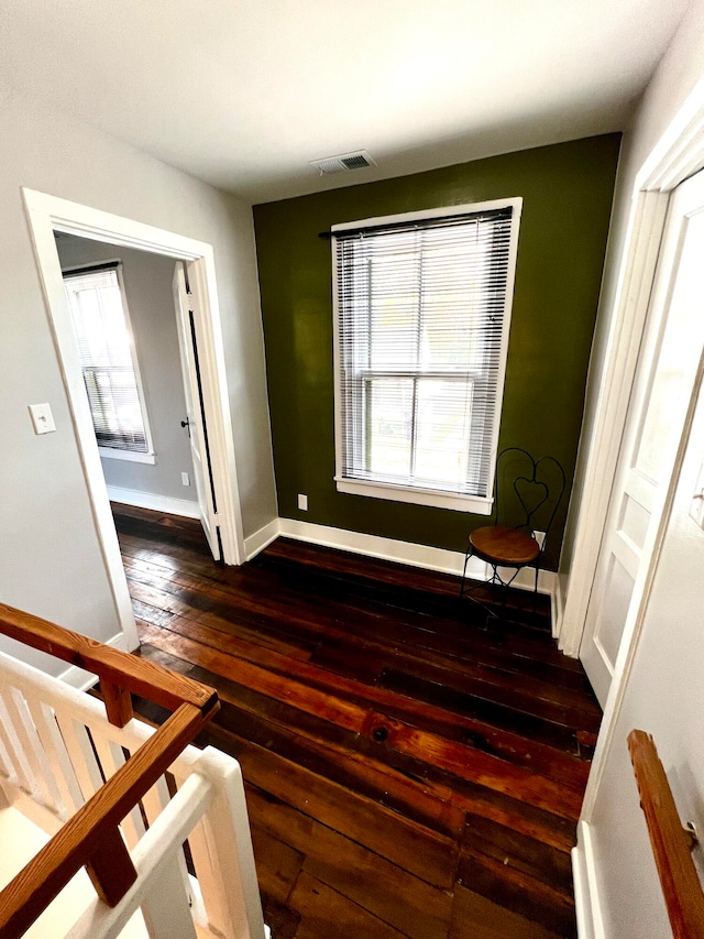 unfurnished bedroom featuring dark hardwood / wood-style floors