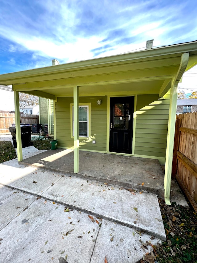 doorway to property featuring a patio area