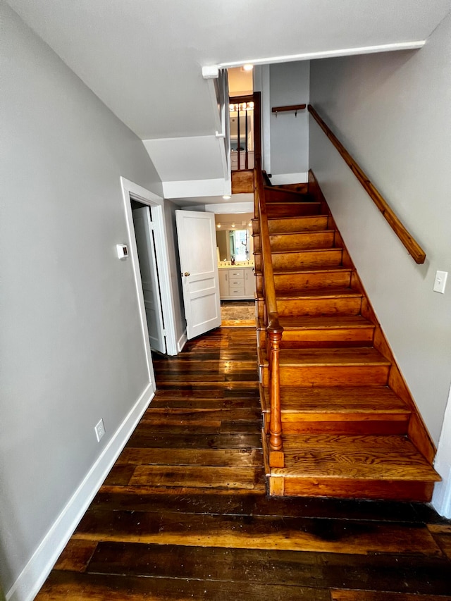 stairs with hardwood / wood-style floors