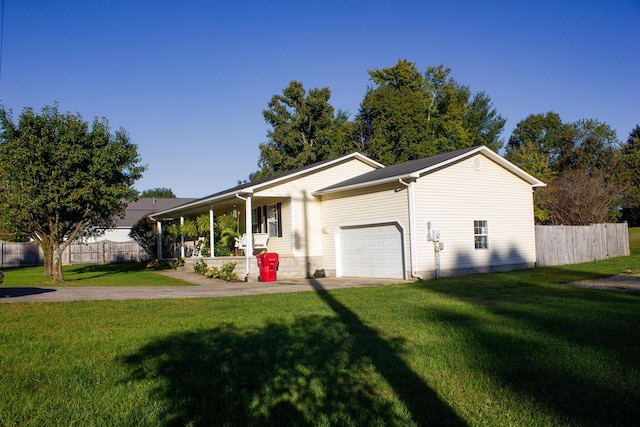 view of front of property with a garage, a front yard, and a porch