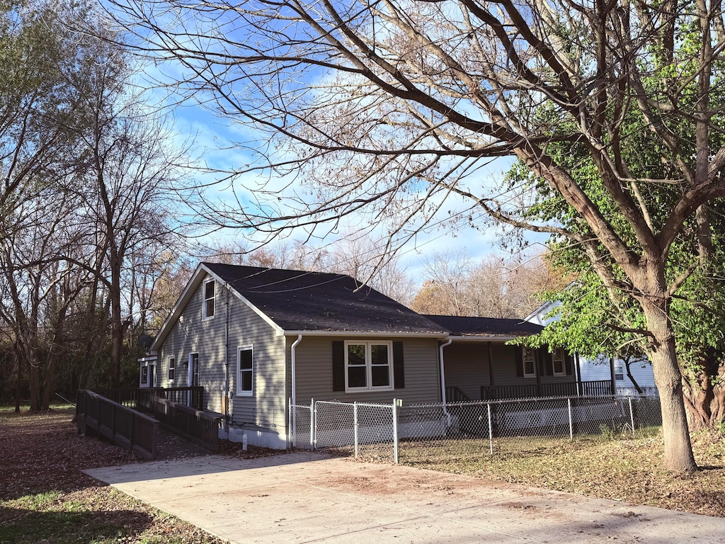 exterior space featuring a yard and a wooden deck