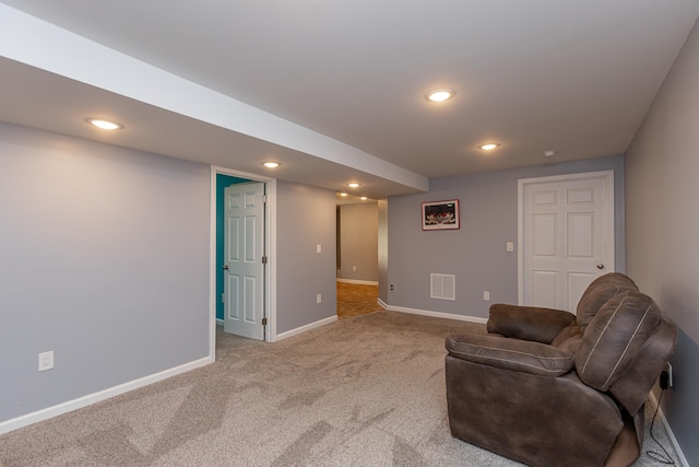 living area featuring carpet flooring