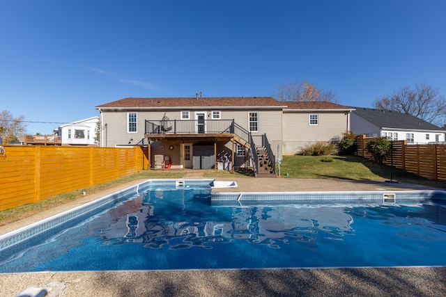 view of pool with a wooden deck