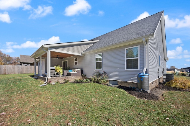 back of house with central AC unit, ceiling fan, a yard, and a patio area