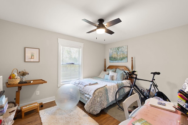 bedroom with hardwood / wood-style floors and ceiling fan