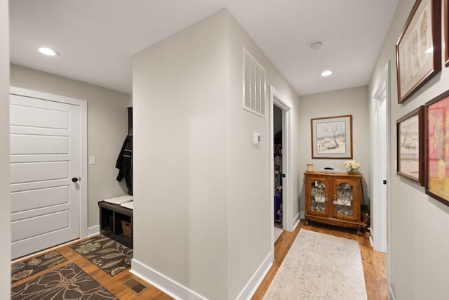 hallway featuring light hardwood / wood-style flooring