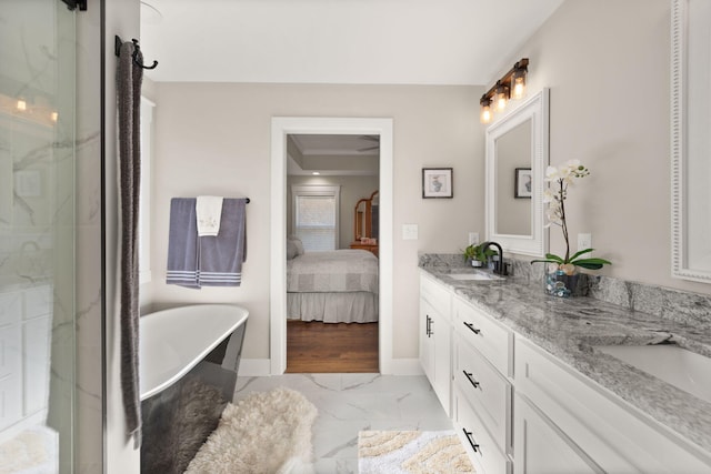 bathroom featuring a bath and vanity