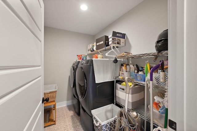 clothes washing area featuring washing machine and clothes dryer