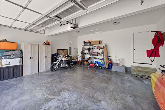 garage with electric panel and a garage door opener