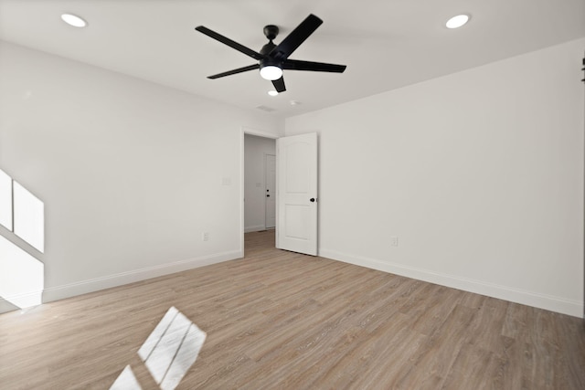 unfurnished room with light hardwood / wood-style flooring and ceiling fan