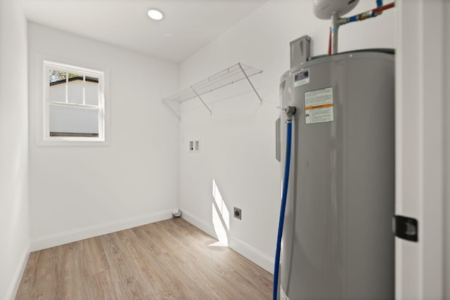 laundry room with light wood-type flooring, water heater, electric dryer hookup, and hookup for a washing machine