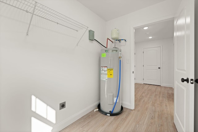 utility room featuring water heater