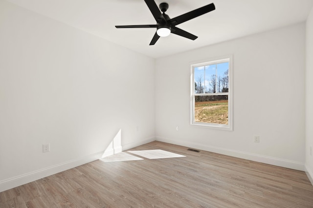 spare room with light hardwood / wood-style flooring and ceiling fan