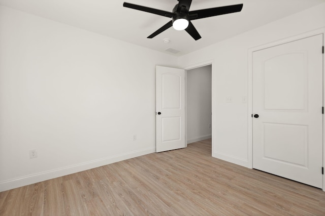 unfurnished bedroom with light hardwood / wood-style flooring and ceiling fan