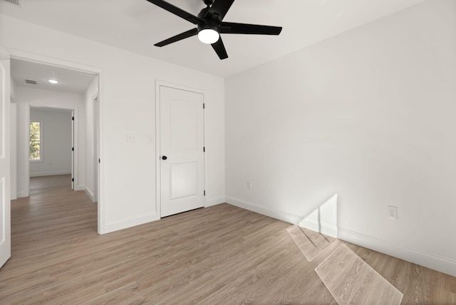 unfurnished bedroom with light wood-type flooring and ceiling fan